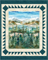 Quilt with a scenic landscape of a lake and forest framed by decorative border